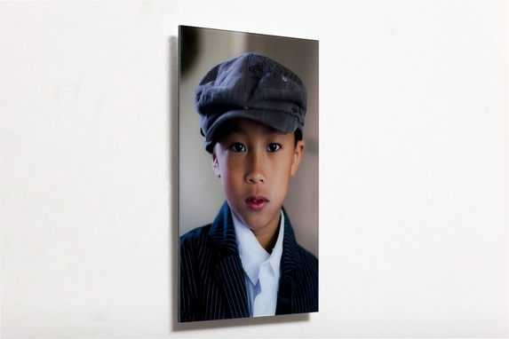 Child portrait photo behind acrylic.