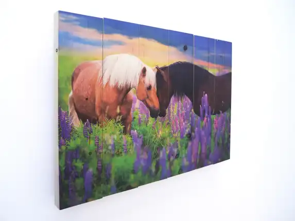 Photo on scaffold wood with horses in nature, creating a warm and rustic look.