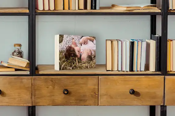You can easily place the wooden photo block in the cupboard or on the windowsill or bedside table.