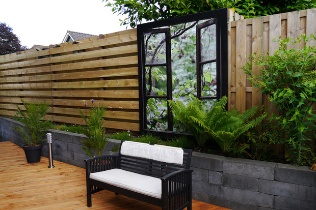 A large format garden poster is a real eye-catcher on the fence.